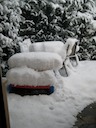 Somewhere under the snow there is a dinner table and a kids' bench...